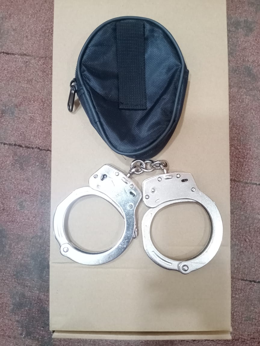 A pair of handcuffs marked Japan with leather pouch