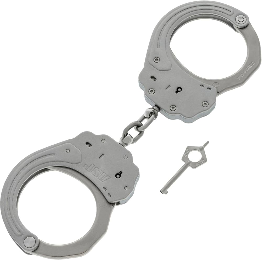 A pair of handcuffs marked Japan with leather pouch